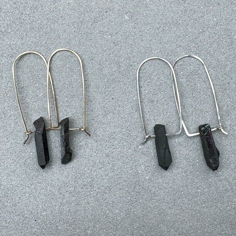 2 sets of black quartz point stones suspended on arched gold and silver wire